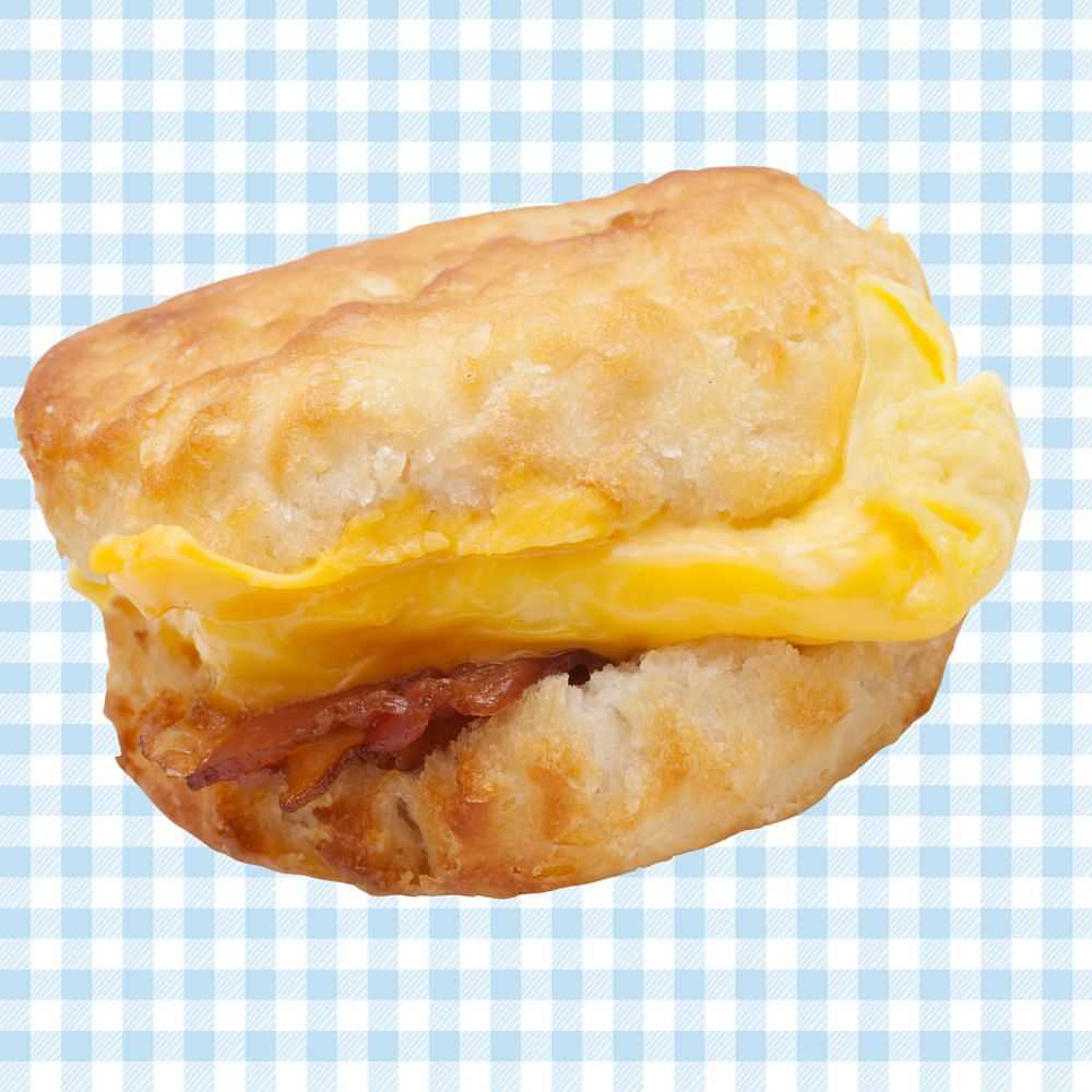 Crispy bacon, cheddar cheese, and a folded egg on a buttery biscuit.